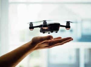 A person controlling a drone camera
